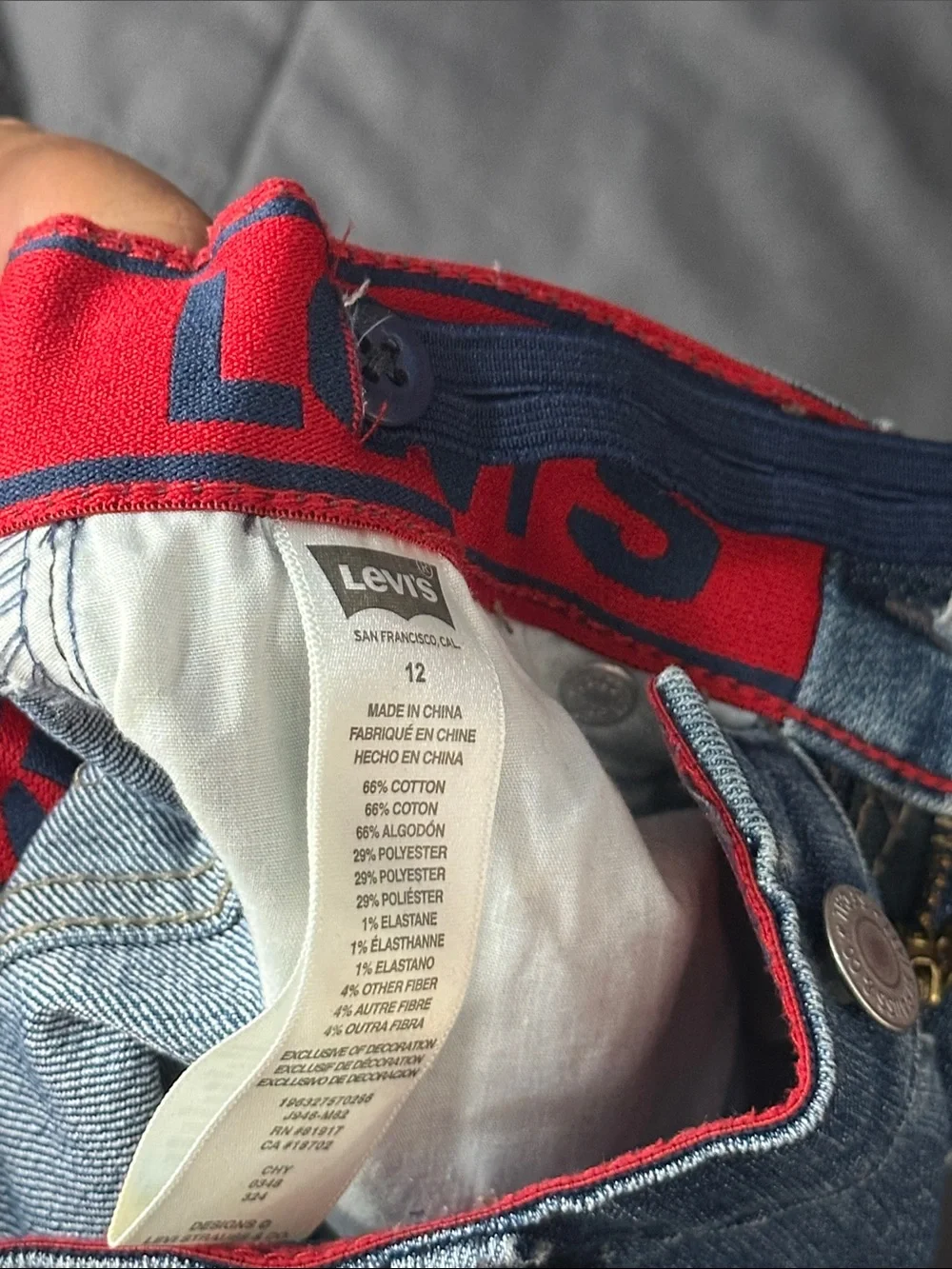 Levi's Straight Men’s Jeans in Medium Blue with Red Waistband Accent